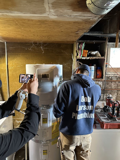 Heat pump hot water tank and a Bob Larson plumber.